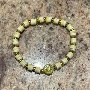 Yellow and white clay beads with smiley bracelet